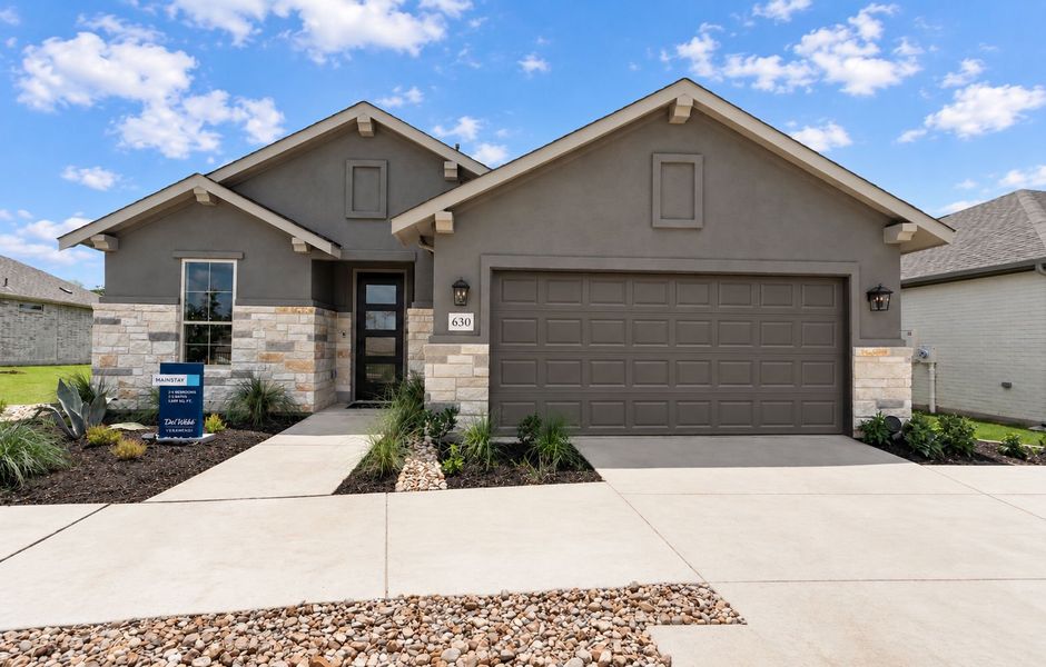 Representative exterior photo of a completed home built from the Mainstay by Del Webb in Del Webb New Braunfels at Veramendi, New Braunfels, TX (Image 15). Representative exterior photo of a completed home built from the Mainstay by Del Webb in Del Webb New Braunfels at Veramendi, New Braunfels, TX (Image 15).
