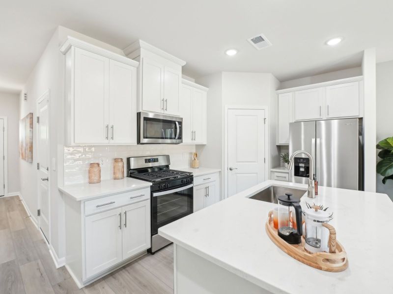 Kitchen in the Topaz floorplan at a Meritage Homes community in Mebane, NC.