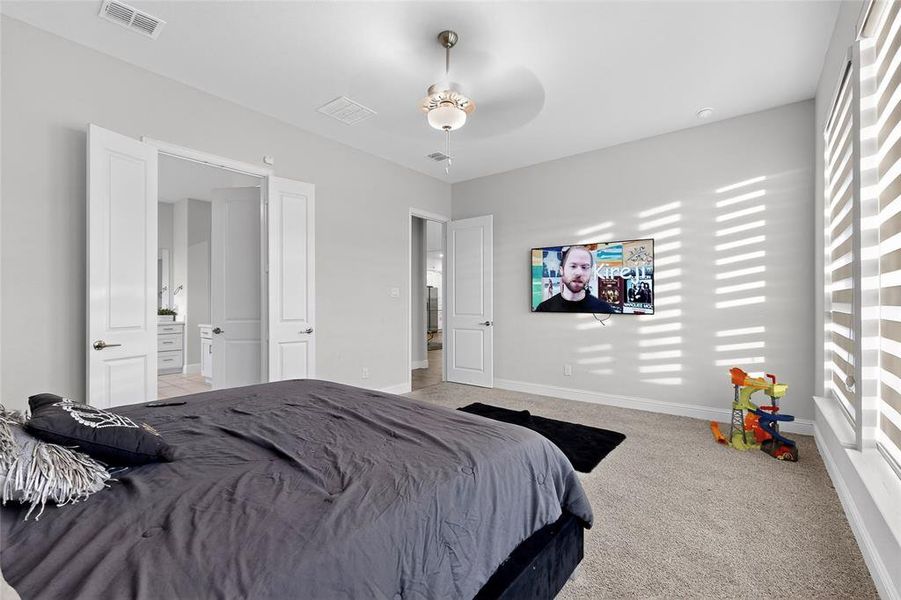 Bedroom with carpet and a ceiling fan