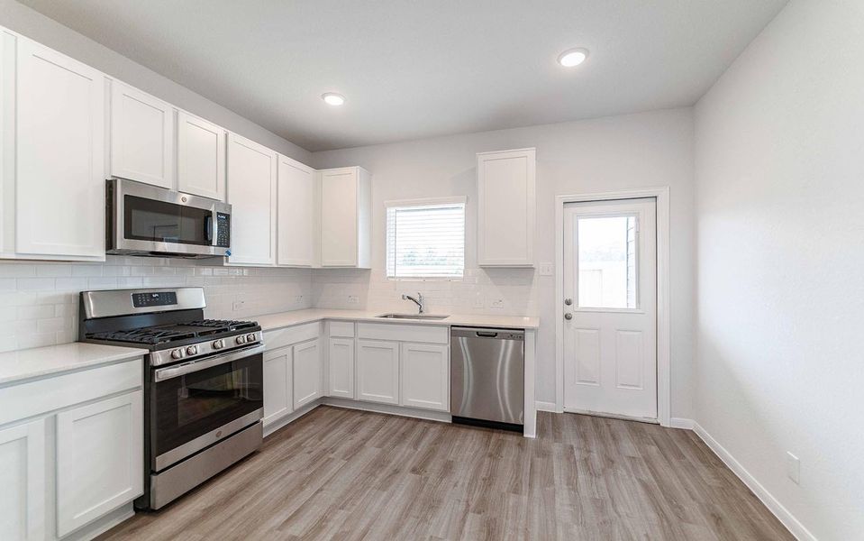 Furnished interior view inside a new home in The Pines at Seven Coves, Willis (Image 2).