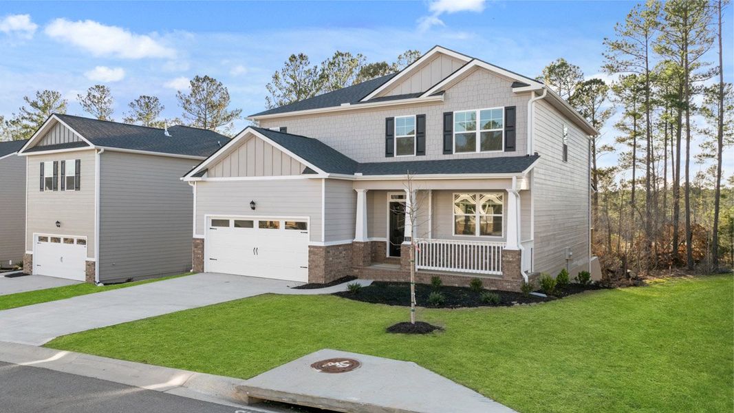 Front exterior of a new home in Southwind Village, Evans, GA, highlighting curb appeal (Image 1).