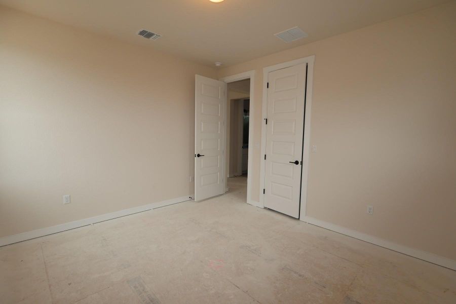 Spacious, unfurnished interior of a new home in Terrace Collection At Turner's Crossing, Buda (Image 6).