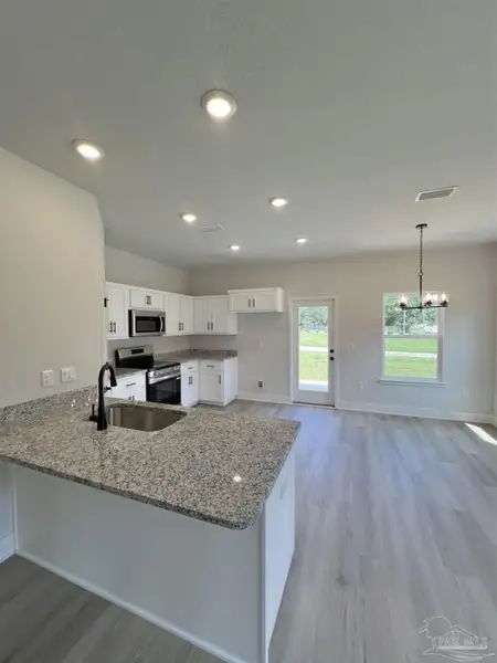 Furnished interior view inside a new home in Allison Acres, Cantonment (Image 4).