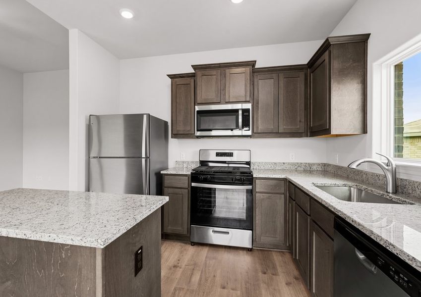 The kitchen has beautiful wood cabinetry. The kitchen has beautiful wood cabinetry.