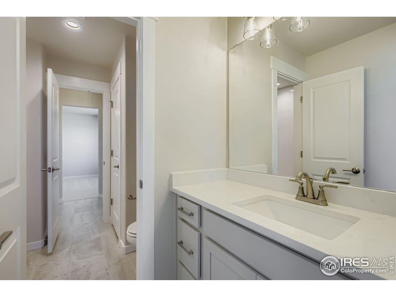 Furnished interior view inside a new home in RainDance National 60/70, Windsor (Image 11).