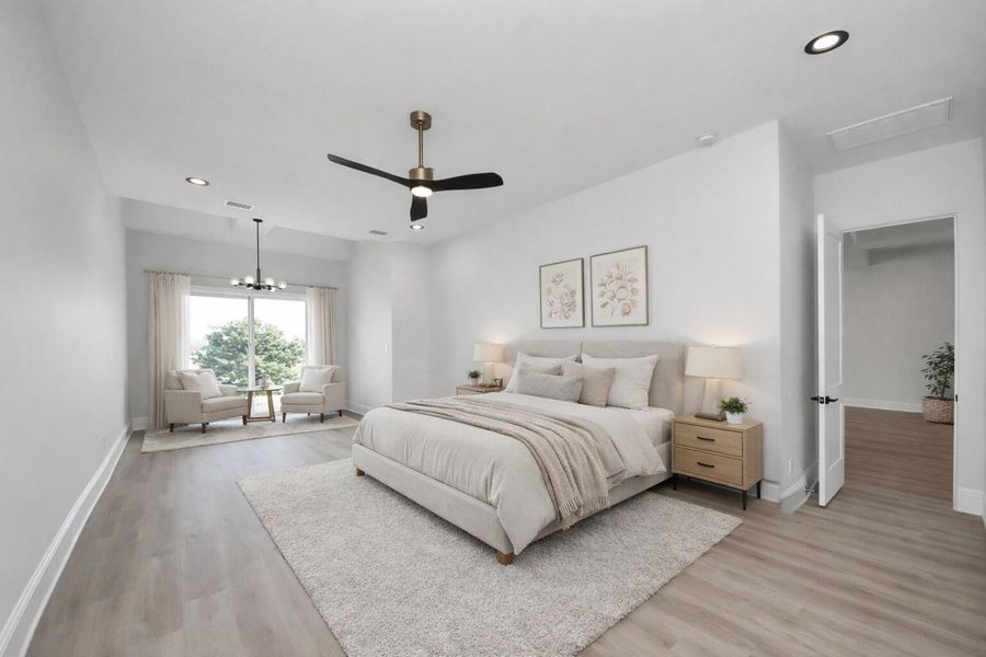 The serene primary suite features a spacious sitting area and French doors that open to an extended patio overlooking the canal, creating a private retreat with seamless indoor-outdoor living. The serene primary suite features a spacious sitting area and French doors that open to an extended patio overlooking the canal, creating a private retreat with seamless indoor-outdoor living.