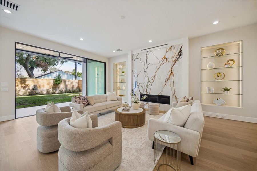 The living area flows into the kitchen, with stacking sliding glass doors leading to the patio and inviting natural light inside. This airy layout creates an ideal backdrop for everyday living as well as entertaining, allowing conversation to carry easily from indoors to out. The living area flows into the kitchen, with stacking sliding glass doors leading to the patio and inviting natural light inside. This airy layout creates an ideal backdrop for everyday living as well as entertaining, allowing conversation to carry easily from indoors to out.