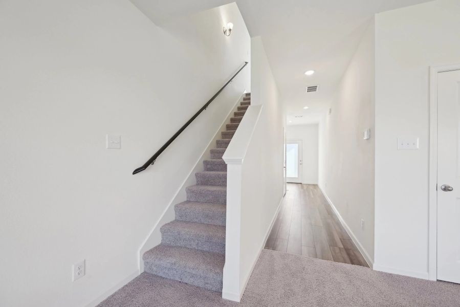 Representative unfurnished interior of a home built from the Voyager by Starlight Homes in Oakfield Lakes, Parrish (Image 18).