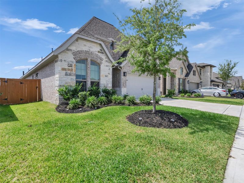 Front exterior of a new home in Marvida, Cypress, TX, highlighting curb appeal (Image 23).
