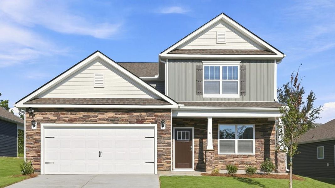 Front exterior of a new home in Woodglen, Piedmont, SC, highlighting curb appeal (Image 1). Front exterior of a new home in Woodglen, Piedmont, SC, highlighting curb appeal (Image 1).