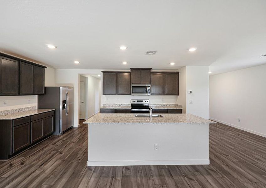 This kitchen has a beautiful granite island.