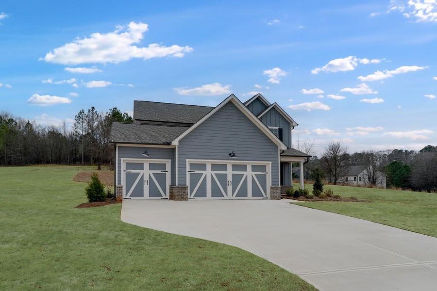 Front exterior of a new home in Wellington Estates, Madison, GA, highlighting curb appeal (Image 20).