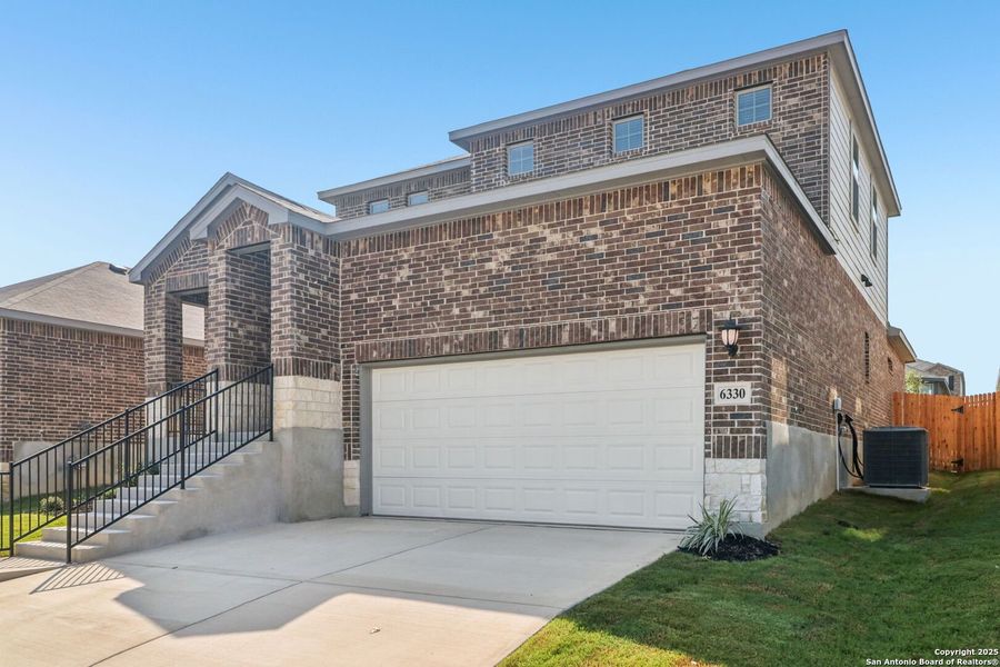 Front exterior of a new home in Comanche Ridge, San Antonio, TX, highlighting curb appeal (Image 19). Front exterior of a new home in Comanche Ridge, San Antonio, TX, highlighting curb appeal (Image 19).