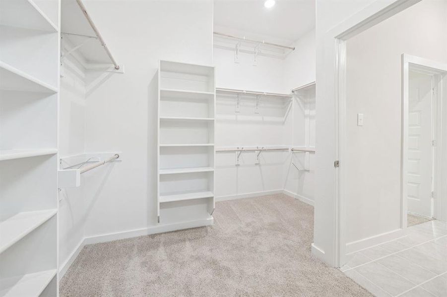 Primary Closet in the Claret home plan by Trophy Signature Homes – REPRESENTATIVE PHOTO Primary Closet in the Claret home plan by Trophy Signature Homes – REPRESENTATIVE PHOTO