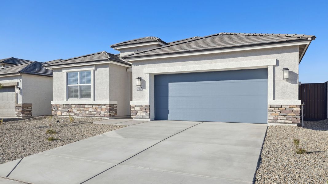 Front exterior of a new home in Desert Moon Estates, Buckeye, AZ, highlighting curb appeal (Image 24).
