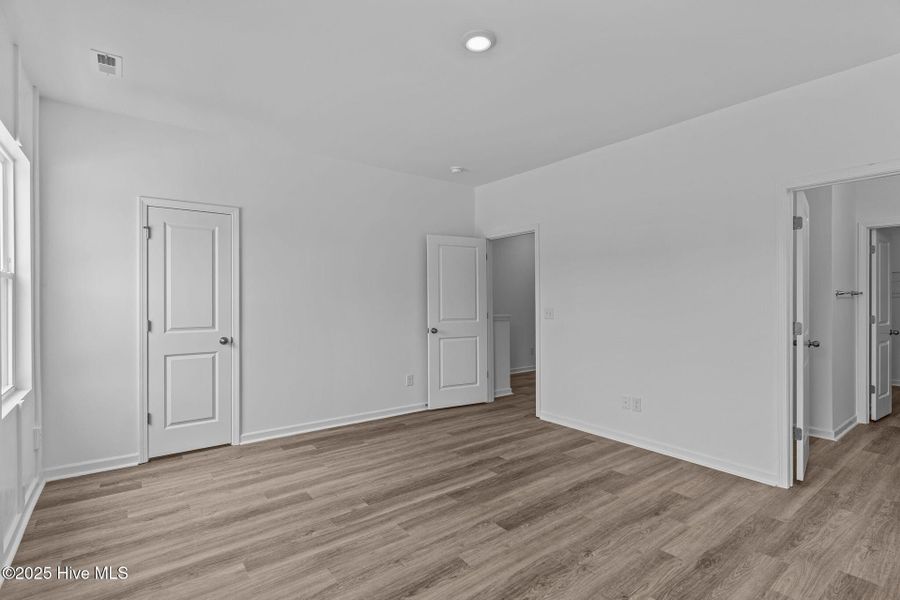 Spacious, unfurnished interior of a new home in Coastal Haven Townes, Leland (Image 26).