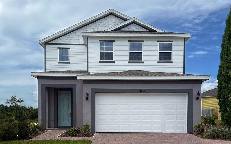 Front exterior of a new home in , Howey-in-the-Hills, FL, highlighting curb appeal (Image 1).