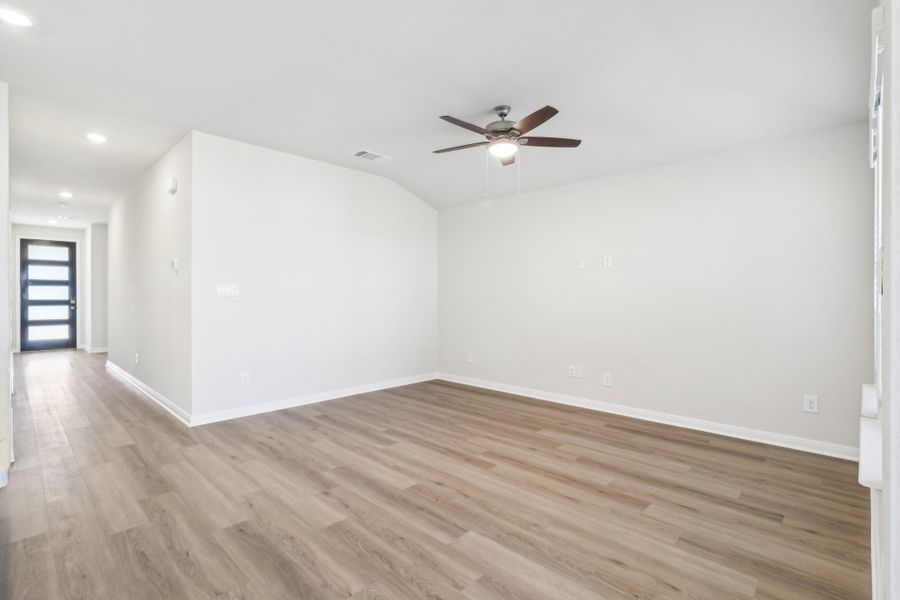 Entry and living room in the Briscoe floorplan at a Meritage Homes community.