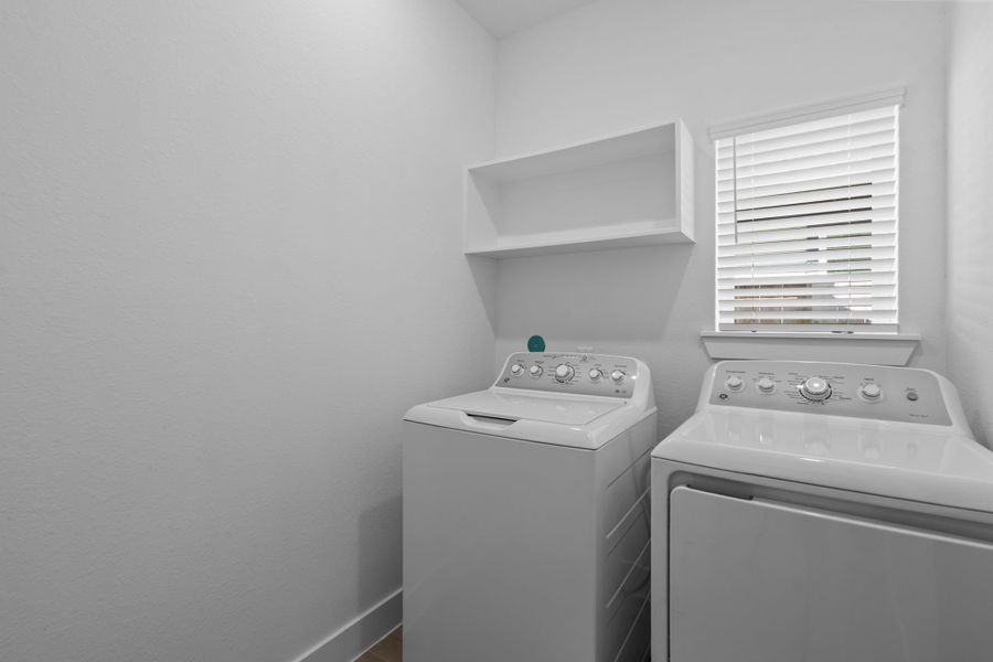 Furnished interior view inside a new home in Meridiana, Iowa Colony (Image 10).