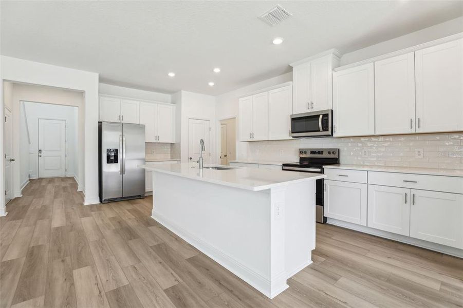Furnished interior view inside a new home in Cyrene at Minneola - Villas, Minneola (Image 6).
