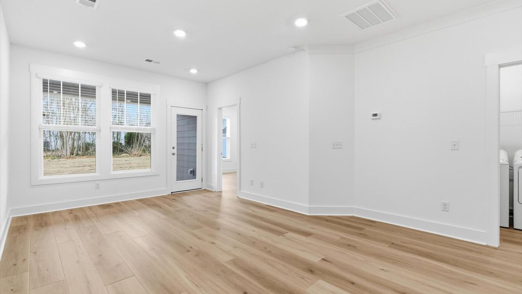 Accomplished layout centers around a spacious family room with exceptional flow and flexibility