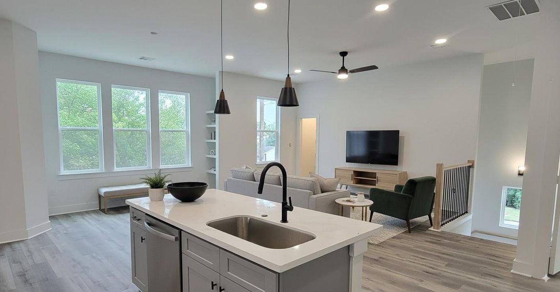 Open concept living space on second floor with living room, dining and kitchen. Open concept living space on second floor with living room, dining and kitchen.