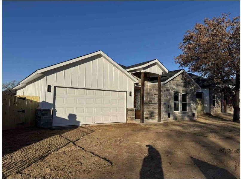 View of front of property featuring a garage