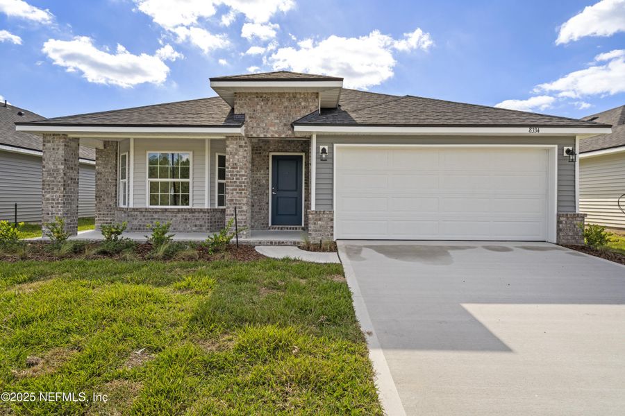 Front exterior of a new home in Summerglen, Jacksonville, FL, highlighting curb appeal (Image 17).