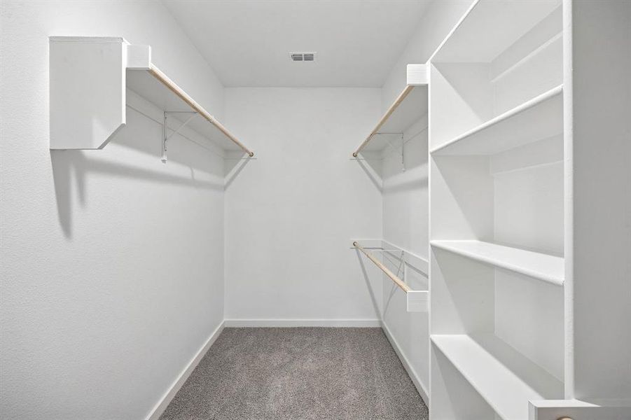 Primary Closet in the Heisman home plan by Trophy Signature Homes – REPRESENTATIVE PHOTO