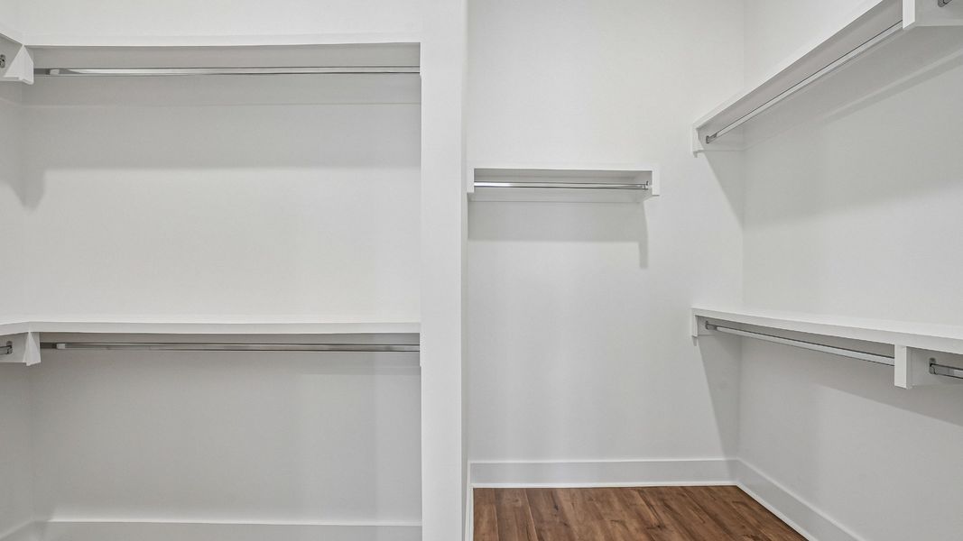 Primary Walk-in Closet with built-in MDF shelving
