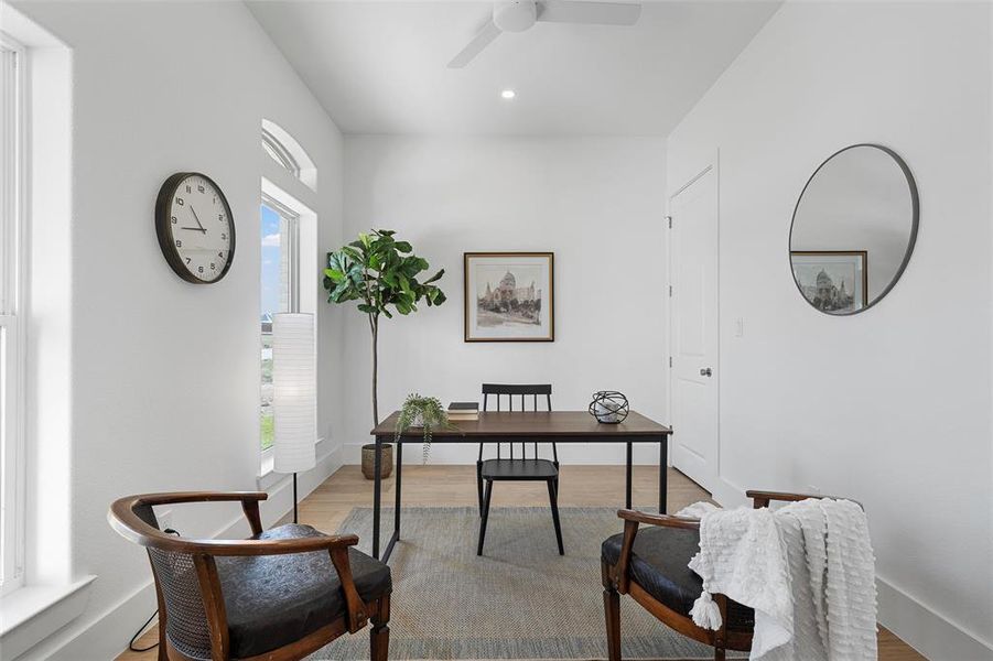 Office space with wood finished floors, ceiling fan, and recessed lighting Office space with wood finished floors, ceiling fan, and recessed lighting