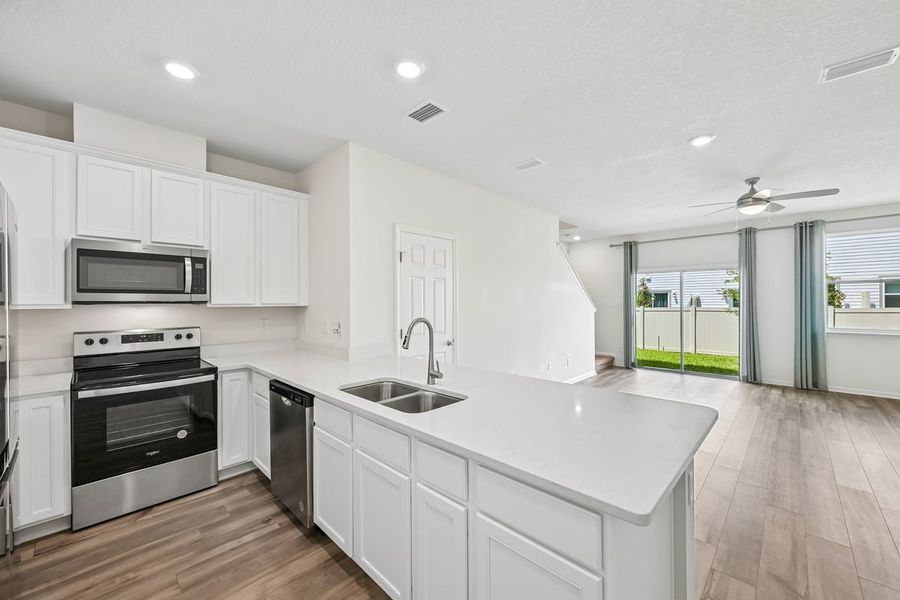 Furnished interior view inside a new home in Orchard Park Townhomes, St. Augustine (Image 8).