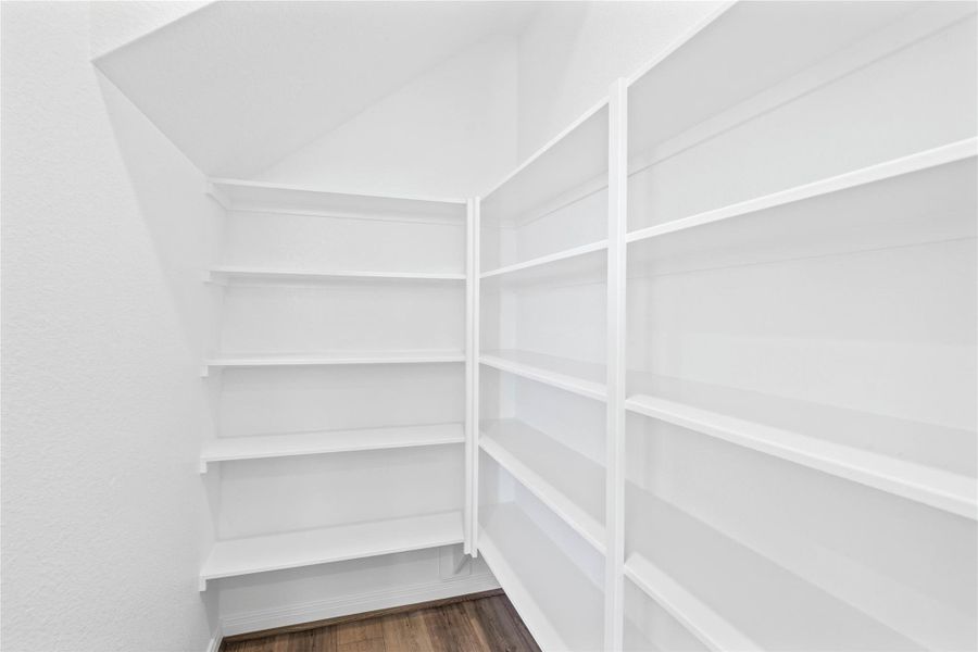 Enjoy an exceptionally organized kitchen with the pantry providing extensive shelving and storage solutions.