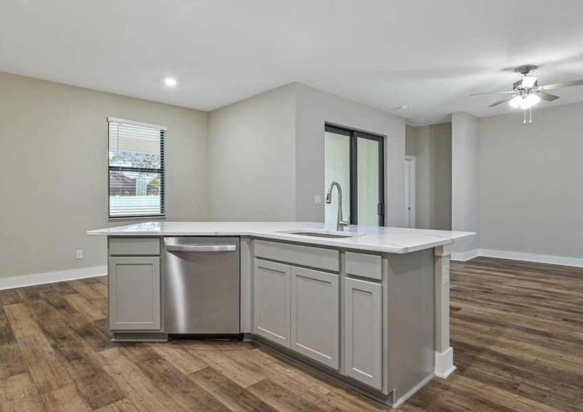 The kitchen has a spacious island that is ready to be the heart of your home