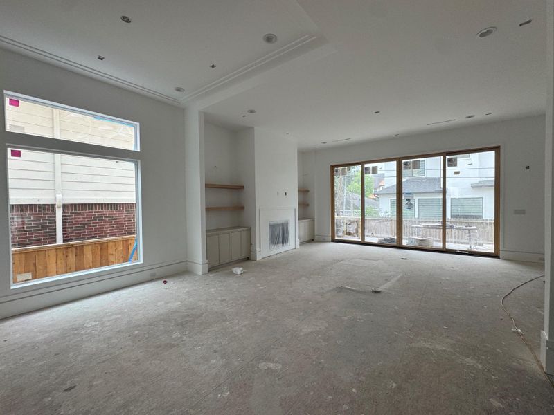 Seamless open-concept dining and living spaces designed for effortless entertaining, featuring abundant natural light and an airy, inviting layout.