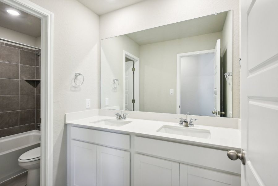 Guest bathroom in the Medina floorplan at a Meritage Homes community.