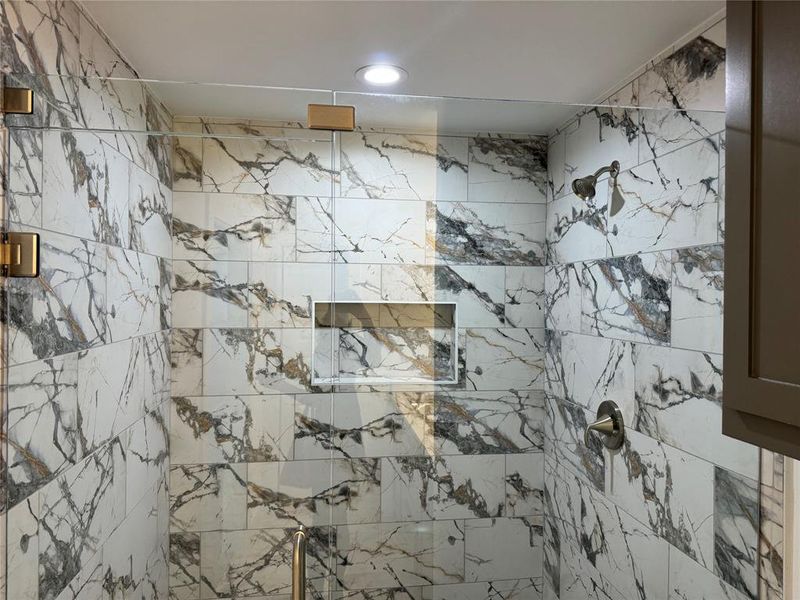 Bathroom with tiled shower