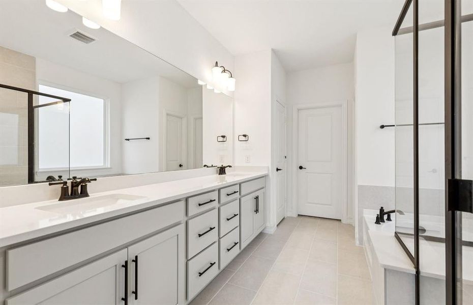 Owner's private bath with double vanity