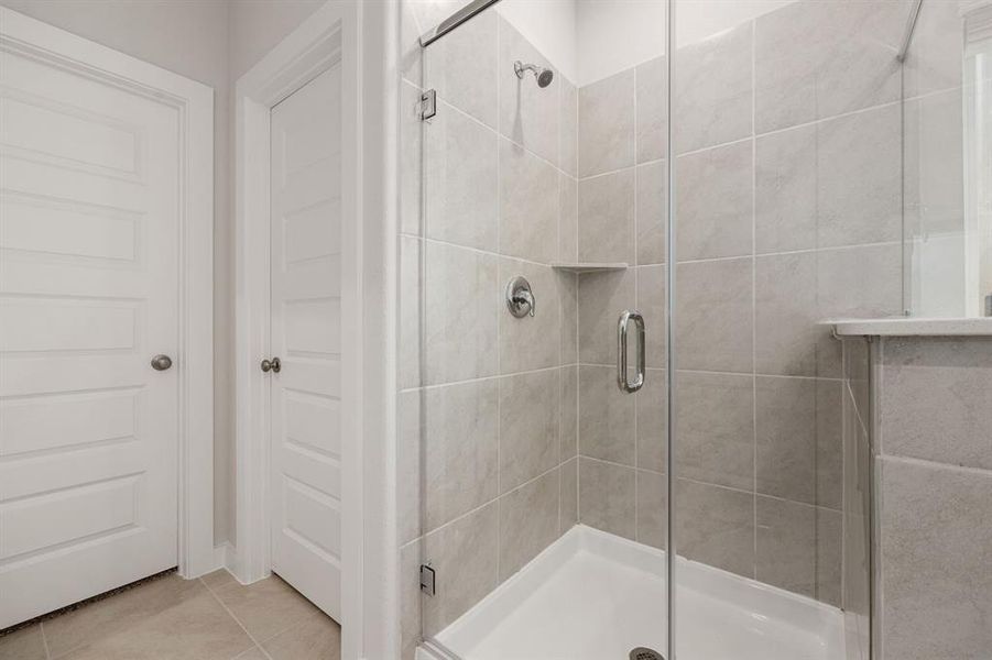 Wash the days worries away in your spa like oversized shower, with tile surround.