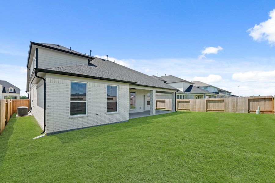 Front exterior of a new home in Briarwood Crossing, Rosenberg, TX, highlighting curb appeal (Image 21).