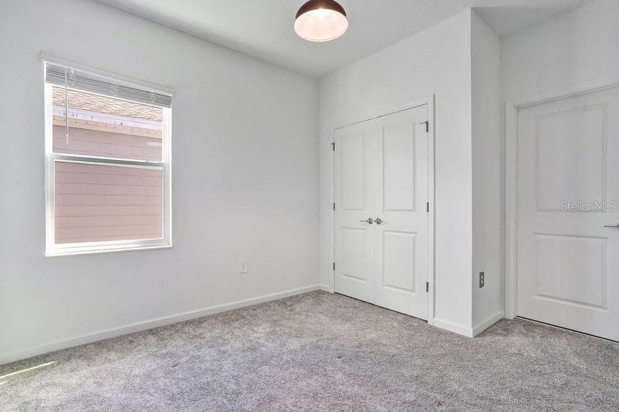 Spacious, unfurnished interior of a new home in Wellness Ridge, Clermont (Image 31).
