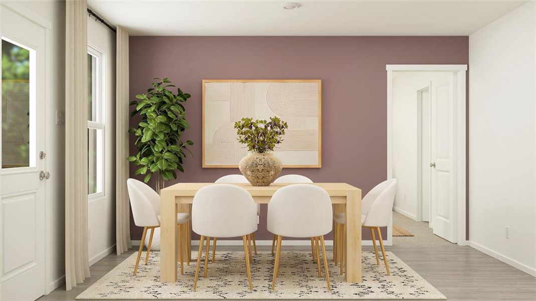 Dining space with light hardwood / wood-style flooring and a wealth of natural light