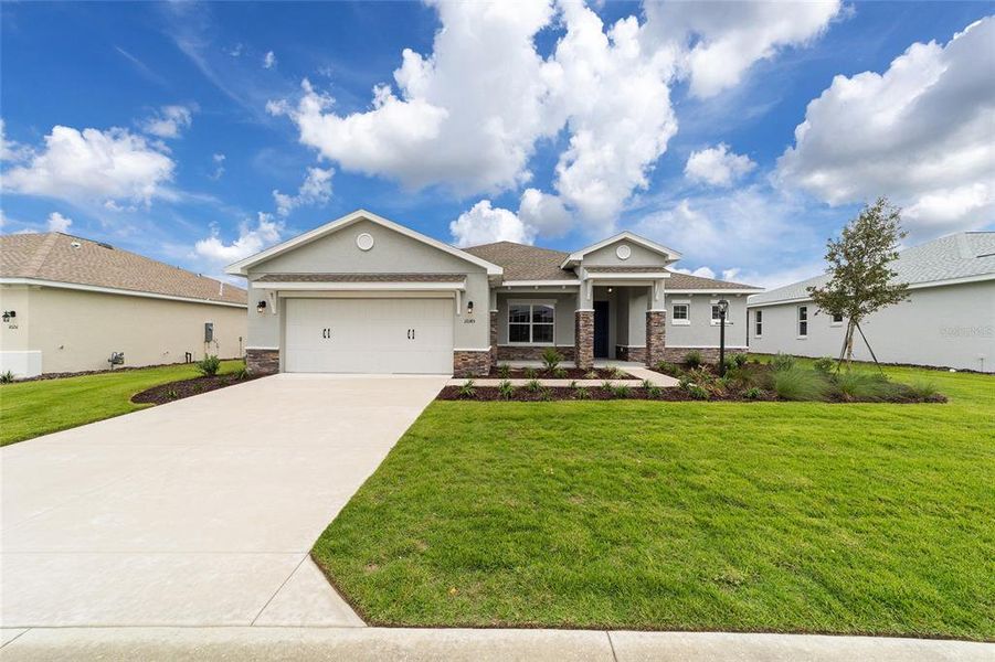 Front exterior of a new home in On Top of the World Communities, Ocala, FL, highlighting curb appeal (Image 2).