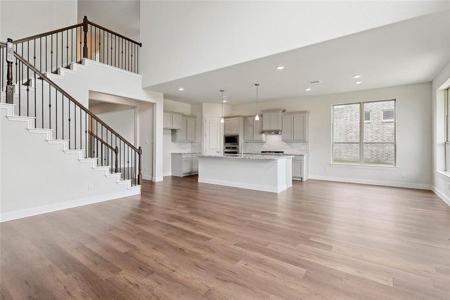 Unfurnished living room featuring light hardwood / wood-style flooring