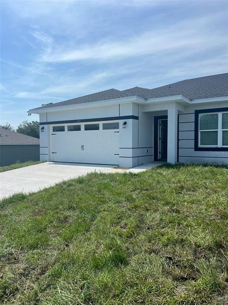 Front exterior of a new home in , Kissimmee, FL, highlighting curb appeal (Image 22).