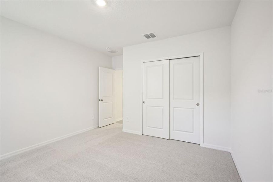 Spacious, unfurnished interior of a new home in The Grove at Stuart Crossing - Classic Series, Bartow (Image 33).