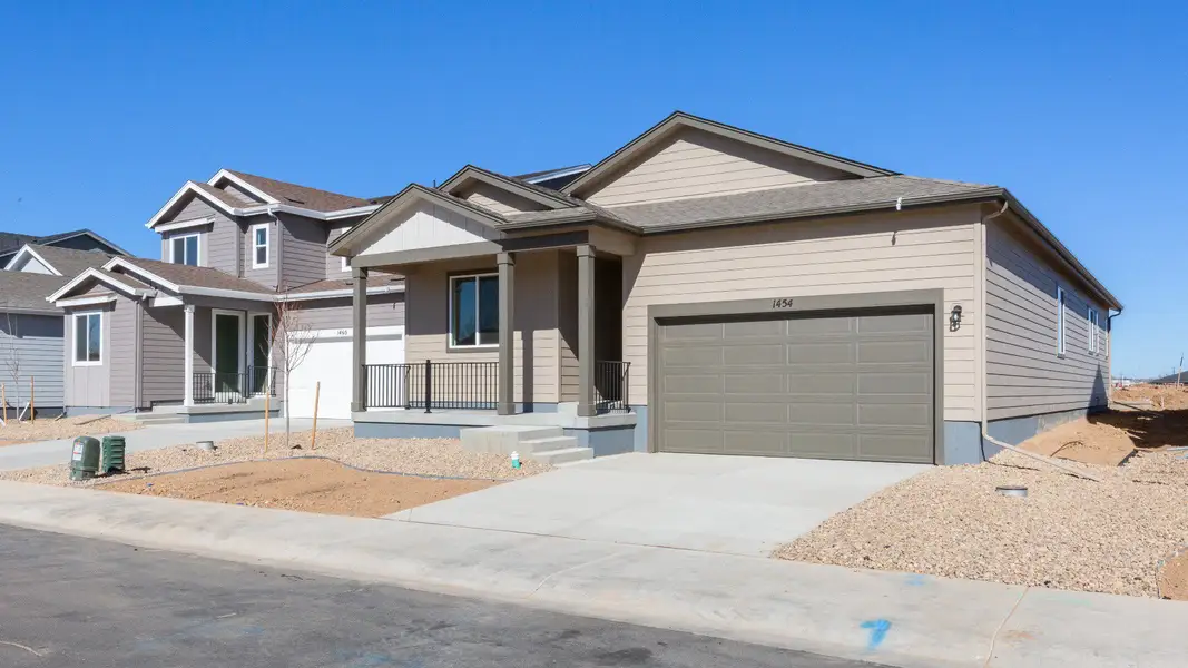 Front exterior of a new home in Trevenna, Windsor, CO, highlighting curb appeal (Image 2). Front exterior of a new home in Trevenna, Windsor, CO, highlighting curb appeal (Image 2).