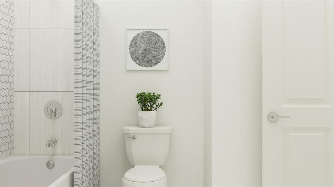 Bathroom featuring shower / bath combo and toilet