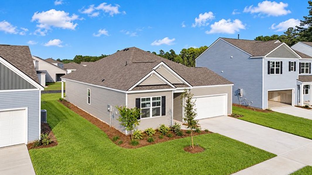 Front exterior of a new home in Pine Hills at Cane Bay, Summerville, SC, highlighting curb appeal (Image 2).