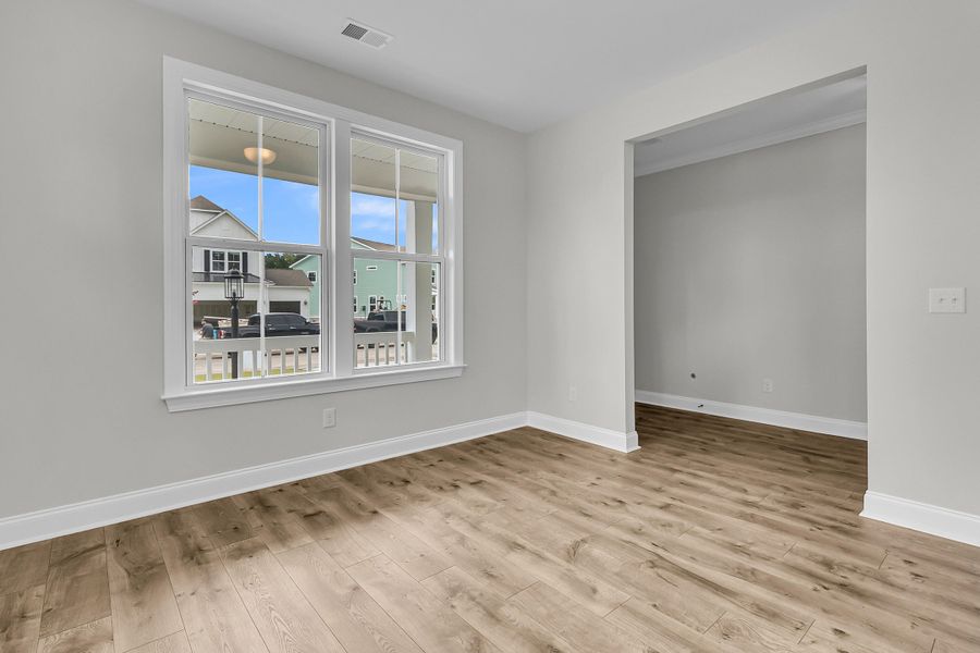 Spacious, unfurnished interior of a new home in Tidewater at Lakes of Cane Bay, Summerville (Image 22).